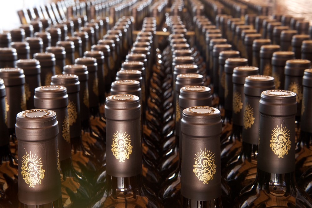 Rows of bottles ageing in the underground store